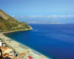 A port of Messina has an entryway at the Strait of Messina which is located at the western shore of the port.